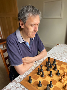 Peter Kirby studying a position over the board.